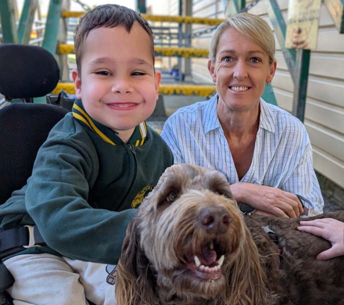 student with slso and therapy dog