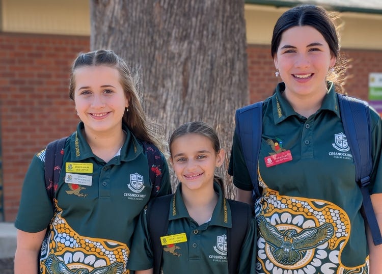 students catching bus with bags